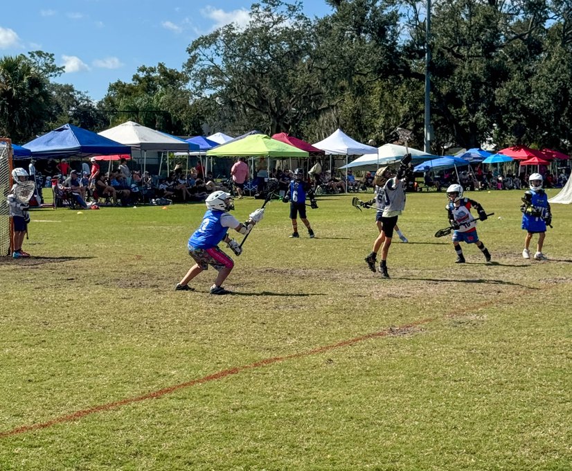 Players sprinting during lacrosse practice