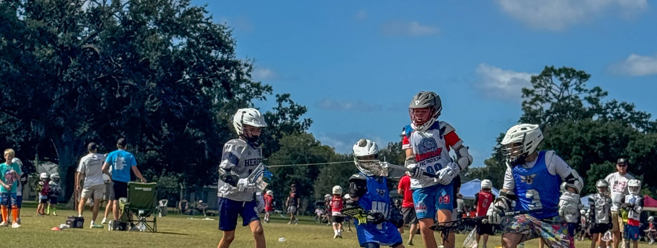 Players competing for ball during lacrosse game