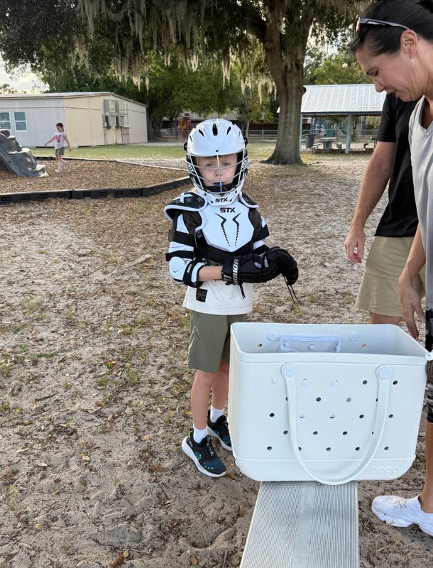 Youth players scrimmaging for ground ball